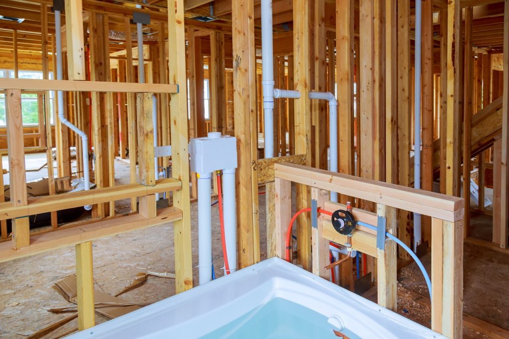 Surviving a Renovation: Plumbing Considerations You Can't Ignore 2 interior wall framing with piping and bathroom ins 2023 11 27 05 22 52 utc